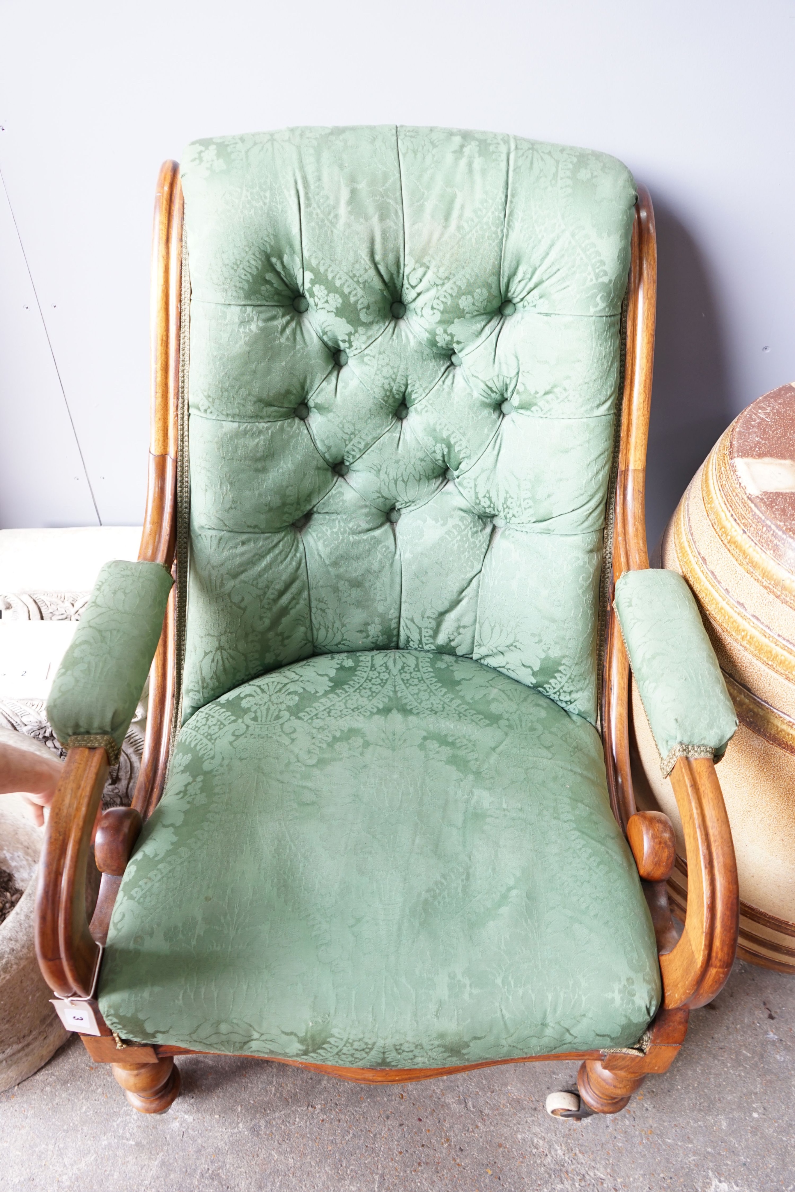 A Victorian mahogany green upholstered open armchair, width 66cm, depth 78cm, height 92cm